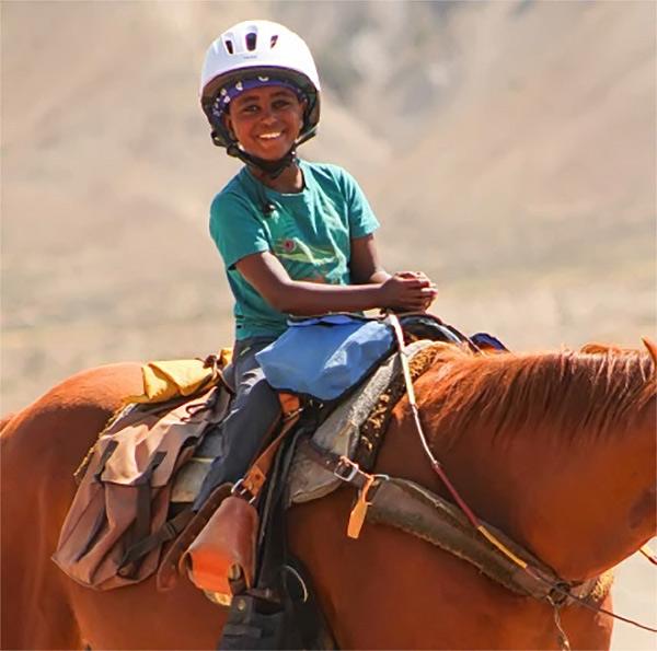Kid enjoying horseback ride