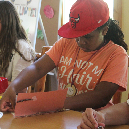 camper doing nature project