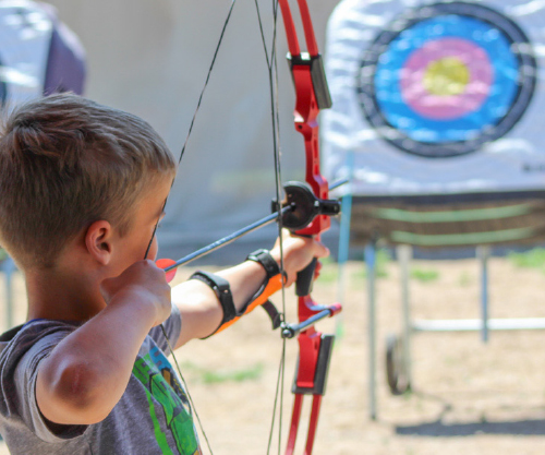 camper doing archery