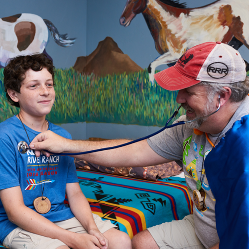 Camper getting a medical evaluation from doctor