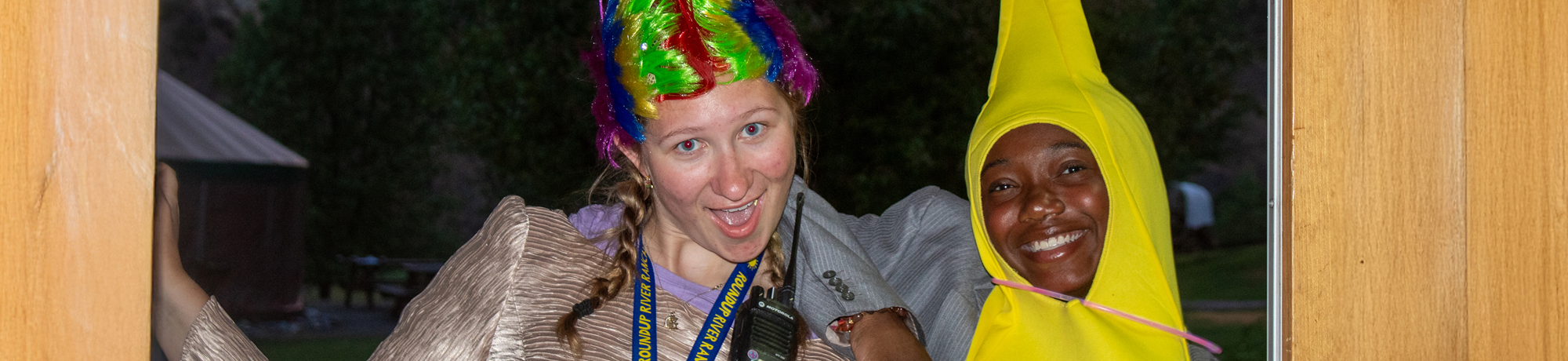 Two camp staff in costumes