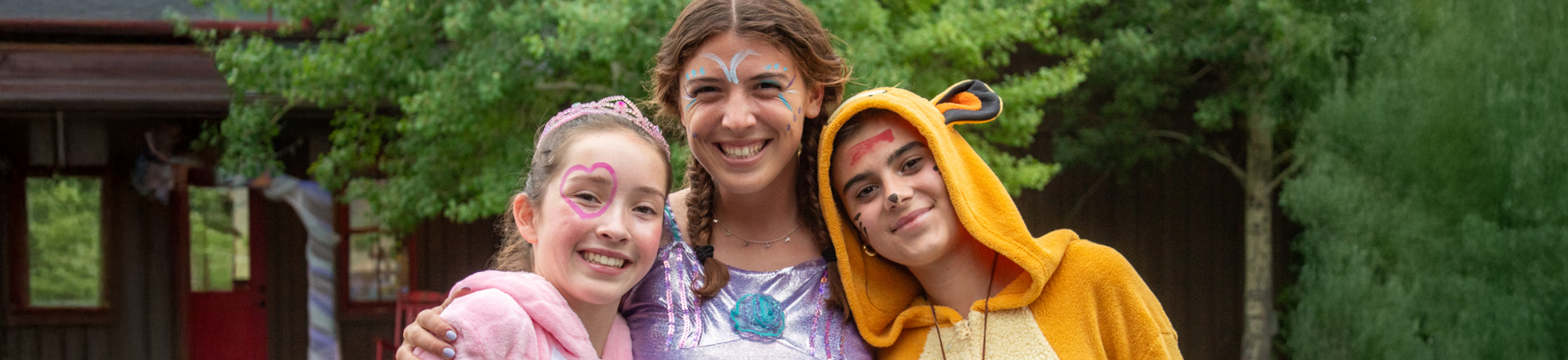 Three campers and camp counselor