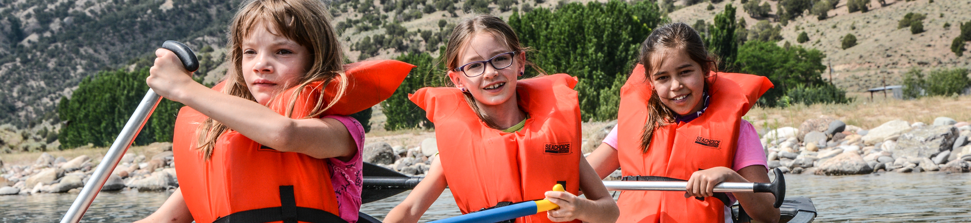 There campers canoeing
