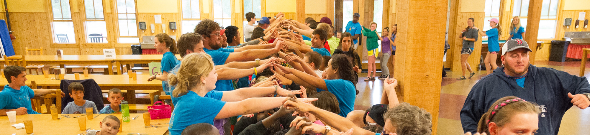 campers making human bridge