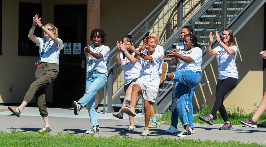 Camper volunteers cheering together