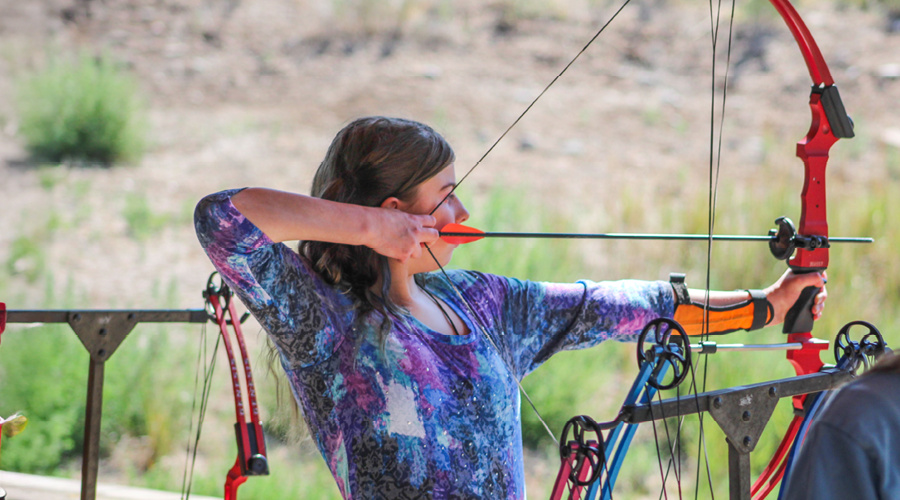 camper doing archery
